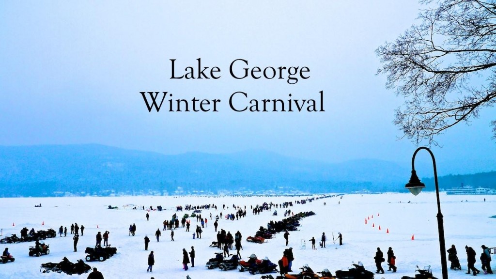 people and snowmobiles on Lake George at winter carnival